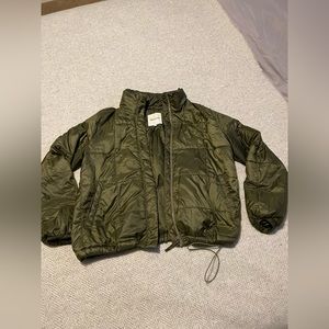 Madewell Travel Jacket in Olive Green - tucks into travel pillow shape